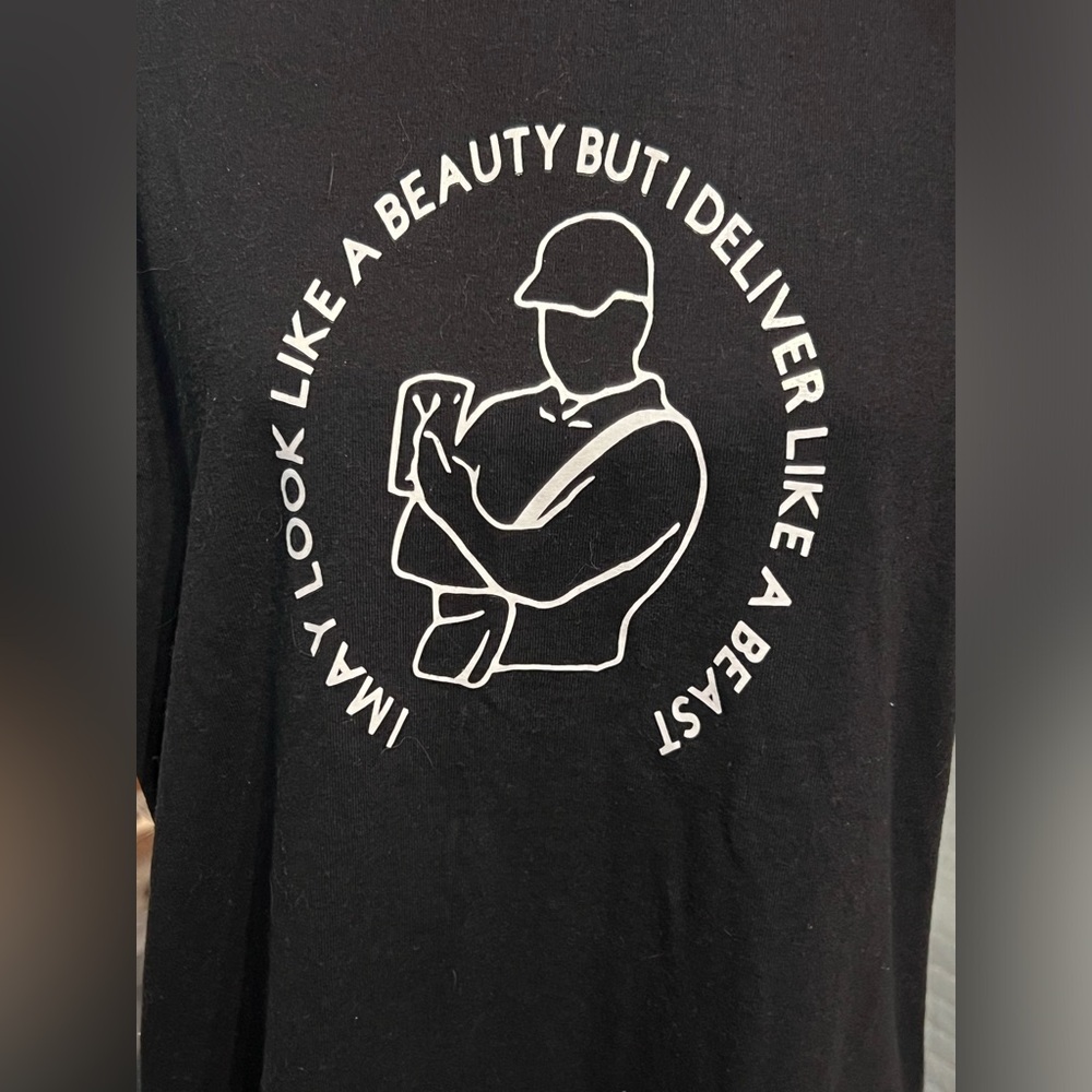 T-shirt I may look like a beauty but I deliver like a beast black size M/L NWOT